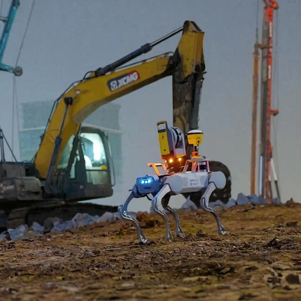 DEEP Robotics quadruped robot carrying a 3D survey scanner while performing construction mapping on a construction site