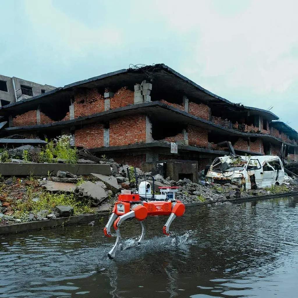 DEEP Robotics quadruped robot walking in water on an earthquake site during emergency rescue operations